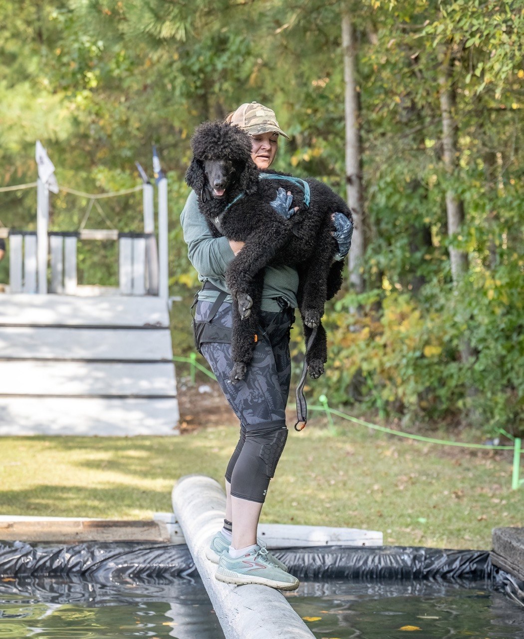 Abigail and Enzo at One World — log over water